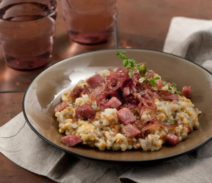 frumenty with caramelized onions and smoked pork
